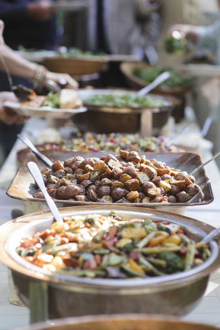 Elegantly catered event with table settings and food displays