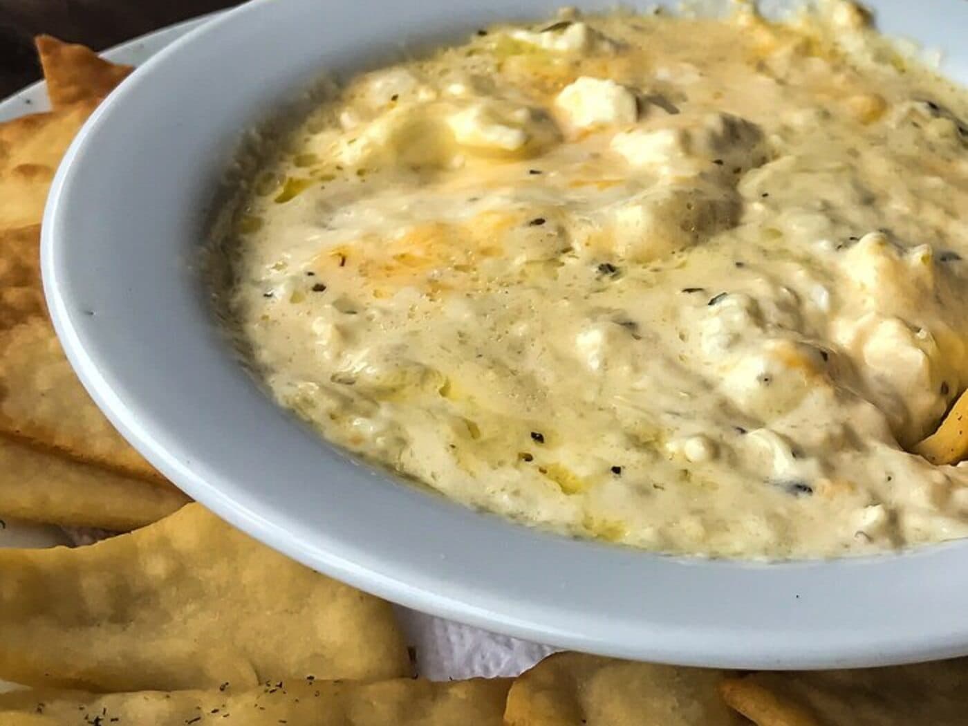 Warm artichoke and spinach dip with toasted pita chips